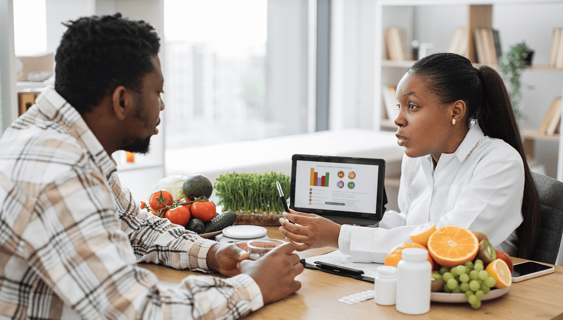 Health consultation with fresh produce and charts